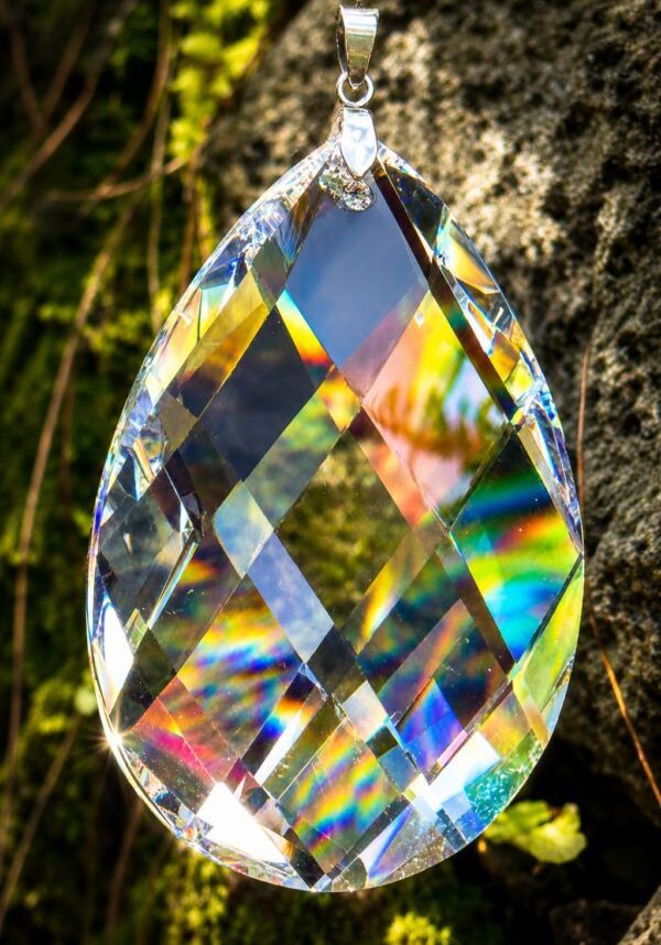 Hanging faceted teardrop crystal prism with rainbows